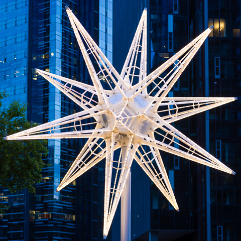 Kilroy Stars large-scale public art light sculpture featuring illuminated geometric star structure with programmable LED lights on urban rooftop